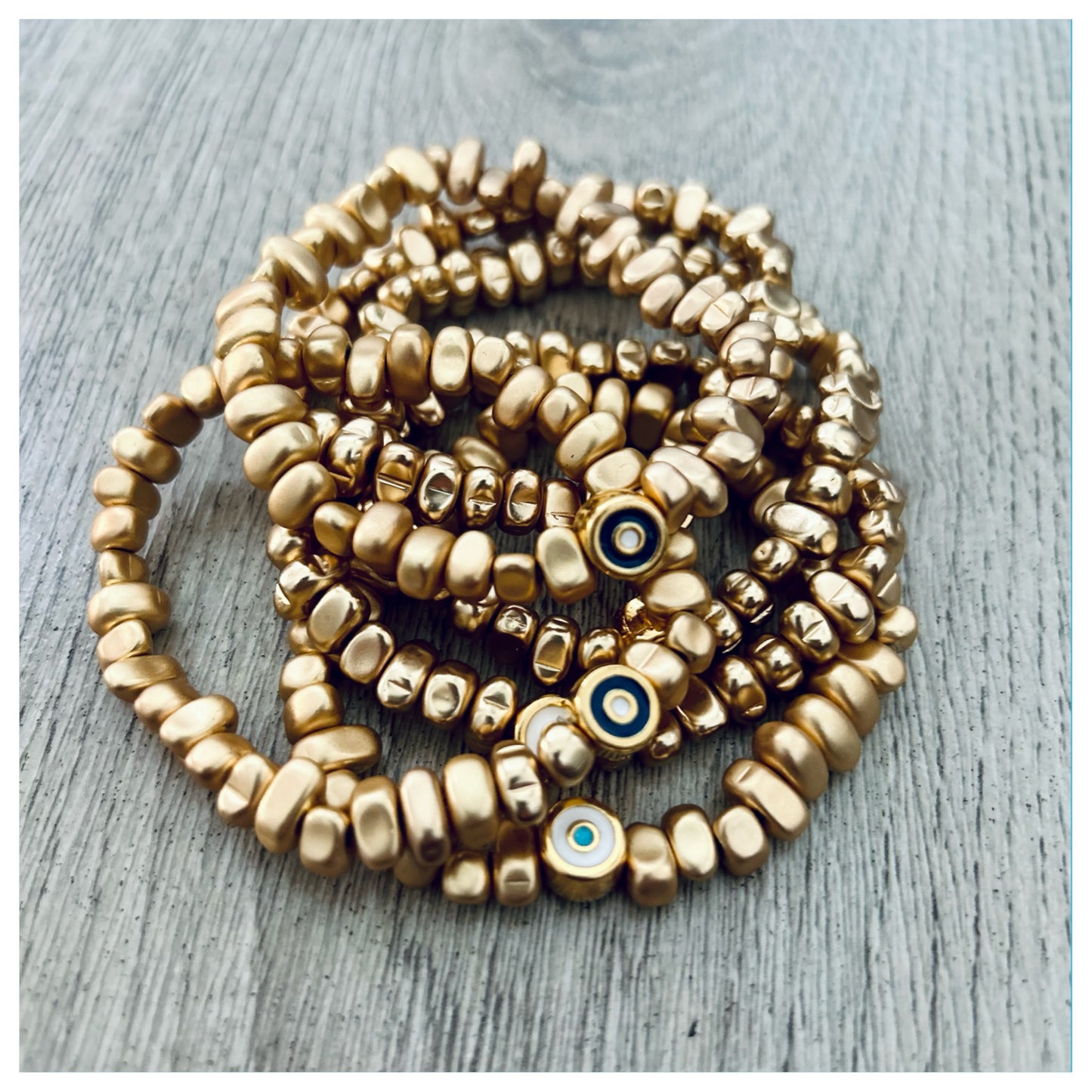 HEMATITE EVIL EYE BEAD BRACELET