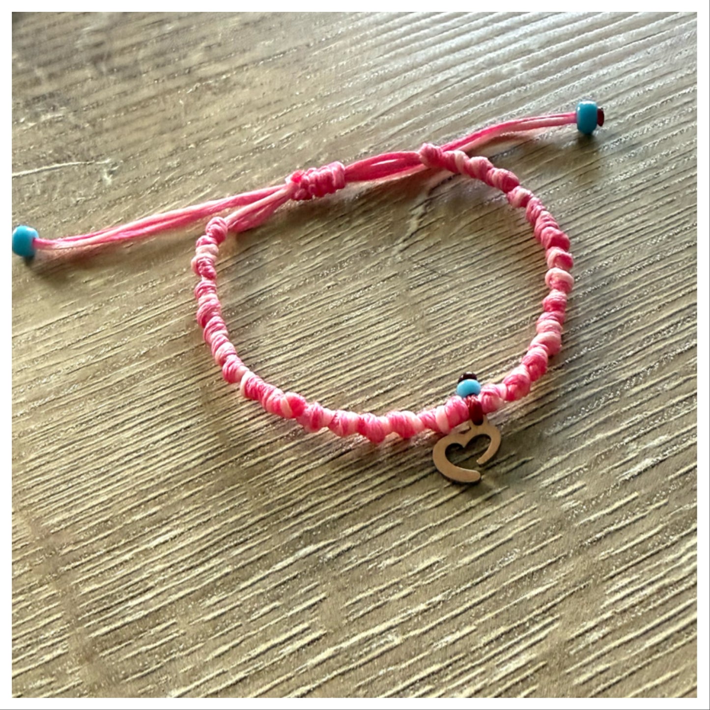 PINK KNOTTED CORD HEART BRACELET