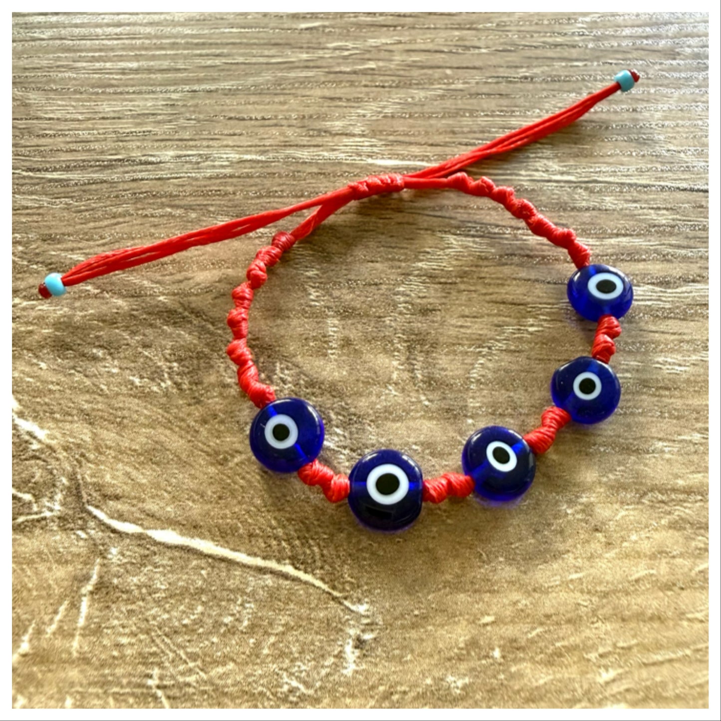 RED KNOTTED EVIL EYE BRACELET