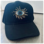 BLACK CAP WITH EVIL EYE EMBELLISHMENT